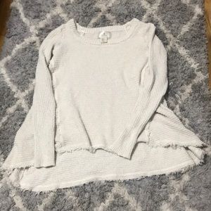High low raw edged sweater